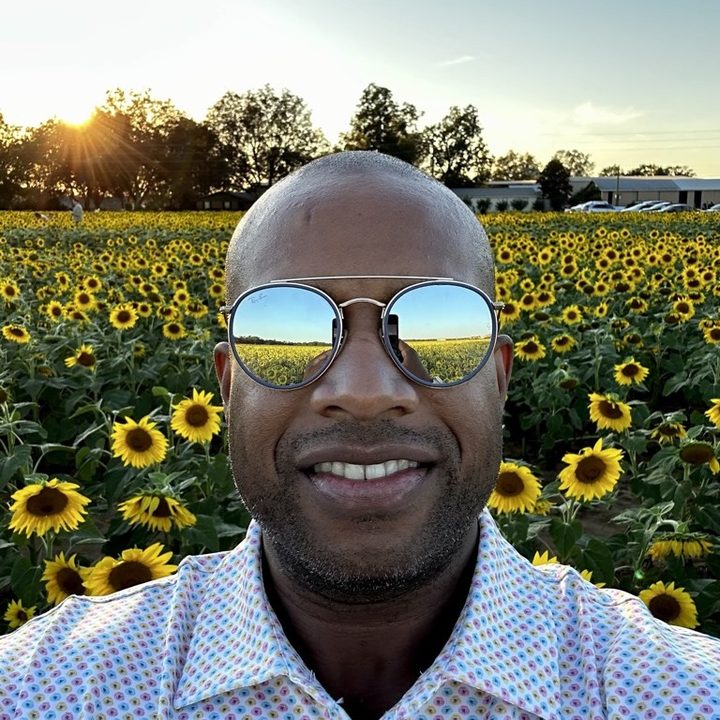 Marcus Henry in a sunflower field